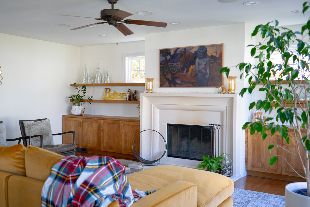 Living room with fireplace and surrounding white custom built-ins