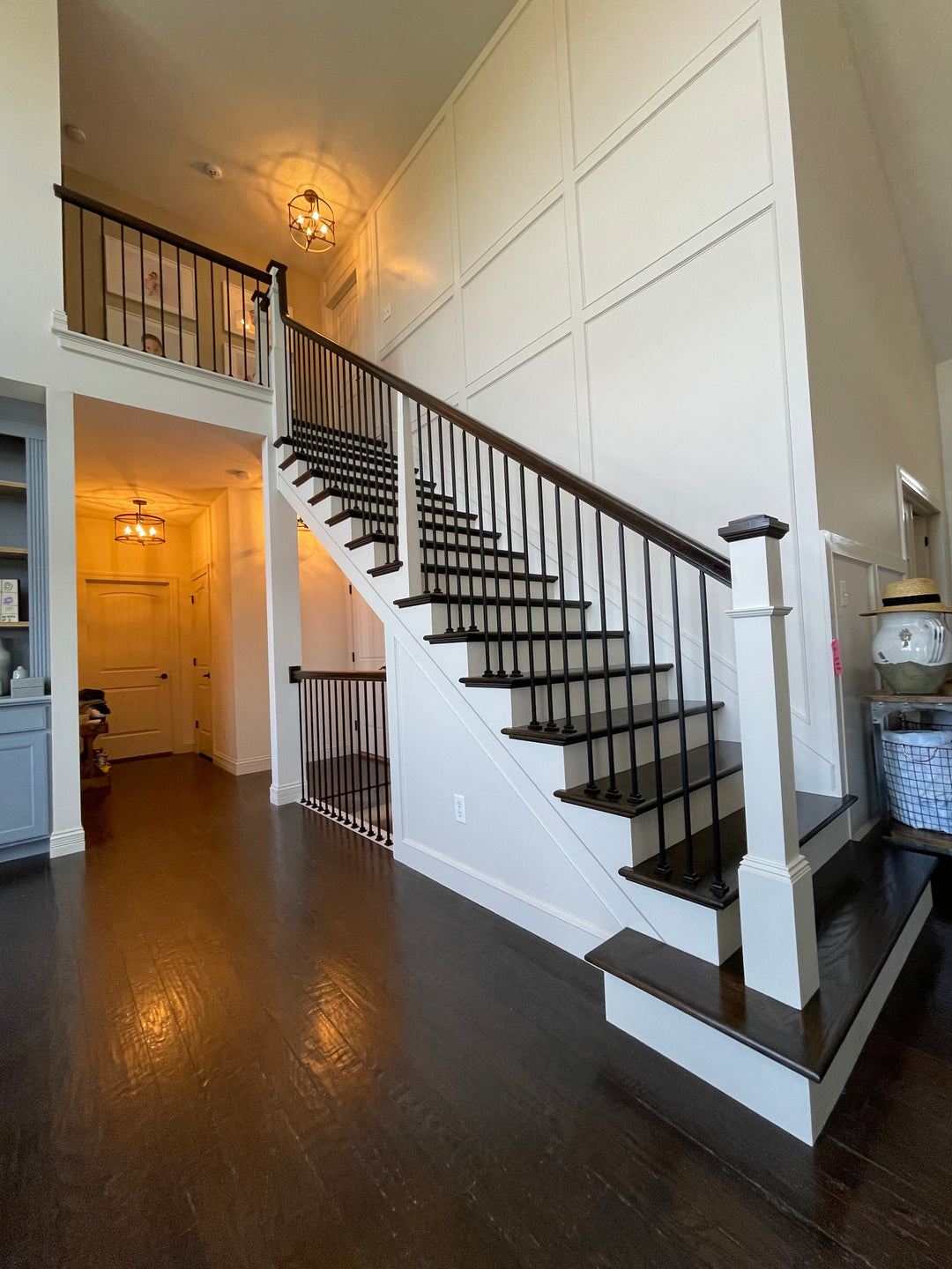 White and wood stairs with iron spindles